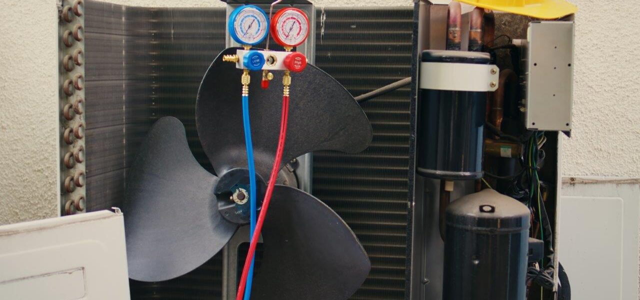 manifold meters used for checking air conditioner refrigerant in need of maintenance