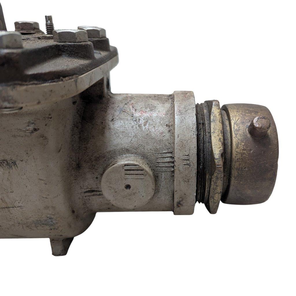 Neptune-3-FH-trident-turbine-awwa-class-II_11 | Chicago HVAC tools and supplies Close-up of a rusted metal valve body with bolts on top and a threaded coupling to the right.
