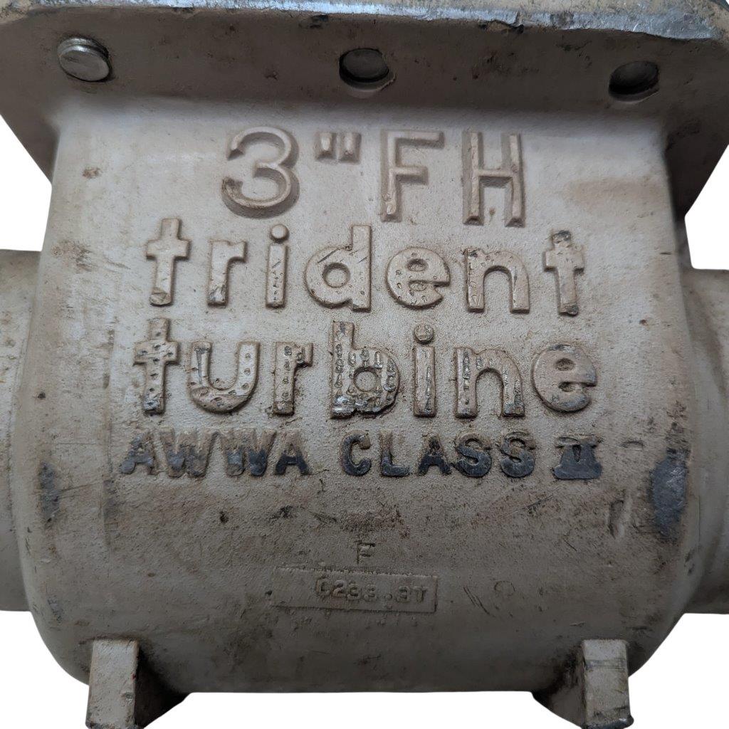 Neptune-3-FH-trident-turbine-awwa-class-II_18 | Chicago HVAC tools and supplies Close-up of a weathered metal valve casting with embossed text: '3" FH Trident Turbine' and 'AWWA CLASS II'