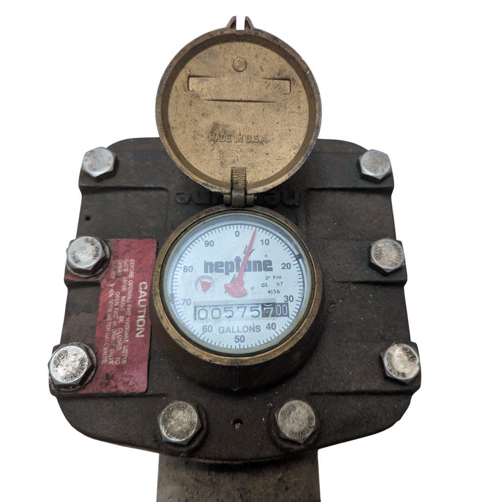 Neptune-3-FH-trident-turbine-awwa-class-II_2 | Chicago HVAC tools and supplies Old water meter with its cover open, showing the dial and an odometer reading about 5,757 gallons.