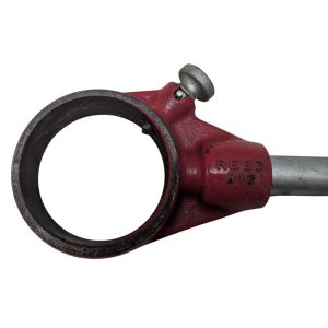 REED-R-12_4 | Chicago HVAC tools and supplies Red metal pipe clamp with circular bore and tightening bolt, mounted on a gray tube, labeled Reed.