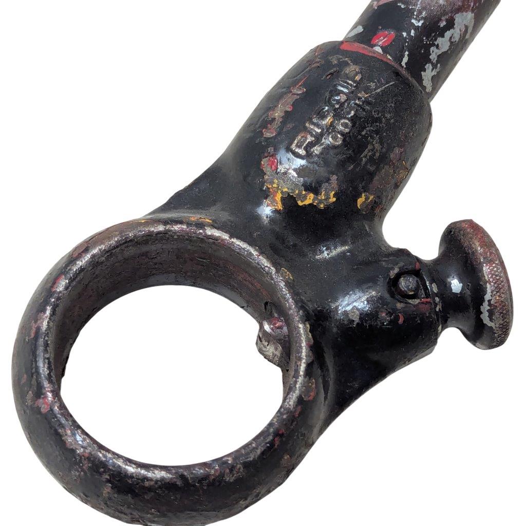 RIDGID-00-R_10 | Chicago HVAC tools and supplies Close-up of a vintage black metal tool with a large circular ring at one end, showing rust and chipped paint