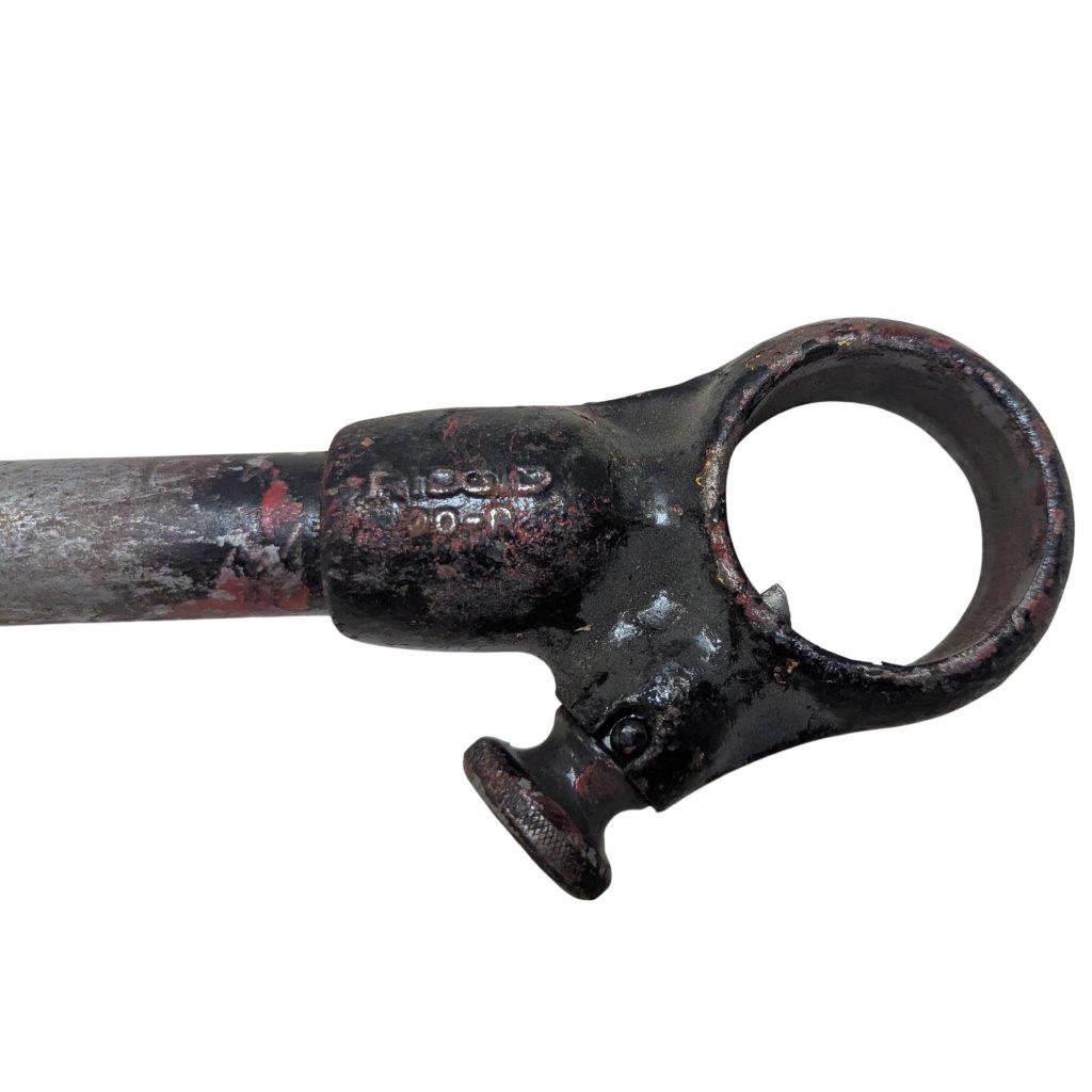 RIDGID-00-R_4 | Chicago HVAC tools and supplies Close-up of a rusted ring-shaped clamp with a circular loop and small screw knob on a metal shaft, showing heavy wear.