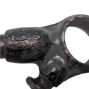 RIDGID-00-R_5 | Chicago HVAC tools and supplies Close-up of a heavily rusted black metal clamp with faded stamped letters on its surface.