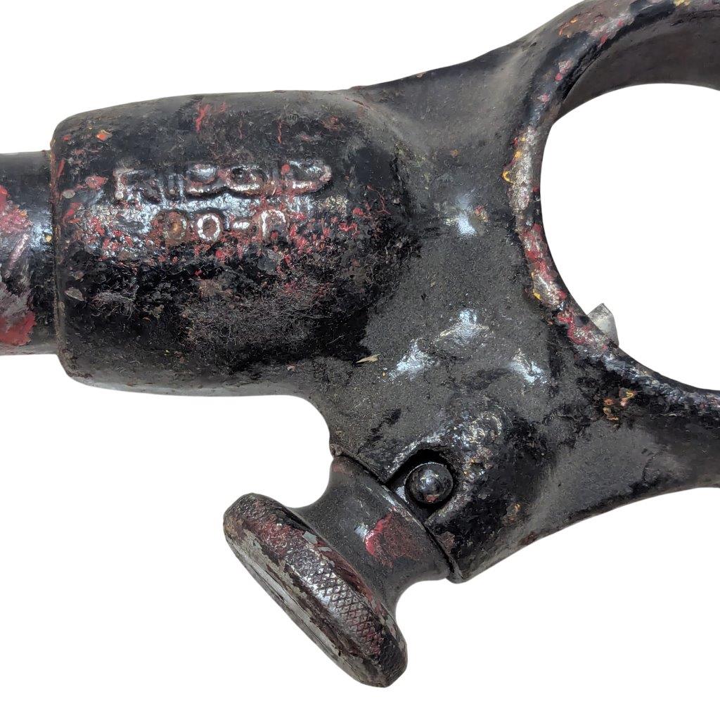 RIDGID-00-R_6 | Chicago HVAC tools and supplies Close-up of a weathered black metal tool component with a knurled knob, showing chipped paint and rust.
