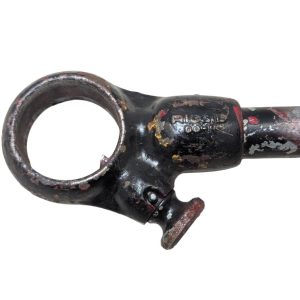 RIDGID-00-R_7 | Chicago HVAC tools and supplies Close-up of a rusted black metal tool with a large circular ring on the left and a small adjustable knob, showing chipped paint and wear.