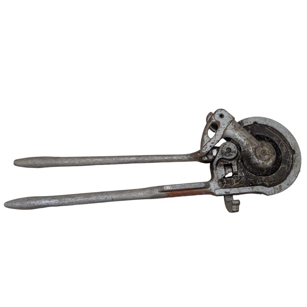 RIDGID-NO-378-Tube-Bender_7 | Chicago HVAC tools and supplies Rusty vintage hand-cranked tool with two long handles and a circular cutting wheel at the head, likely an old can opener or similar cutter.