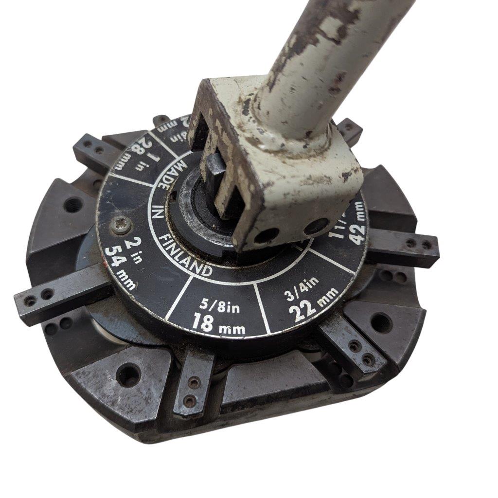 T-DRILL-ND-54-Tube-End-Notcher_10 | Chicago HVAC tools and supplies Rotary tool accessory: circular indexing dial with measurement markings and a square central arbor on a rusty shaft.