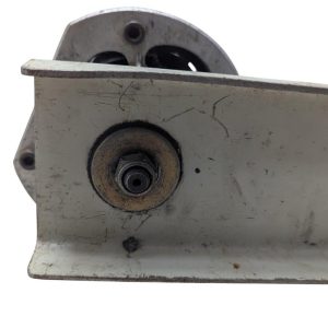 T-DRILL-ND-54-Tube-End-Notcher_17 | Chicago HVAC tools and supplies Close-up of a rusted metal mounting bracket with a circular bolt and a wheel peeking from behind
