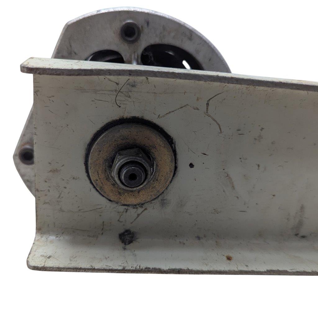 T-DRILL-ND-54-Tube-End-Notcher_17 | Chicago HVAC tools and supplies Close-up of a rusted metal mounting bracket with a circular bolt and a wheel peeking from behind