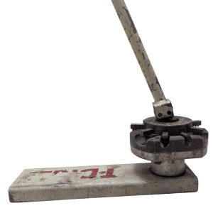 T-DRILL-ND-54-Tube-End-Notcher_6 | Chicago HVAC tools and supplies Vintage manual lever press with a circular rotating die and long metal handle on a rectangular base.