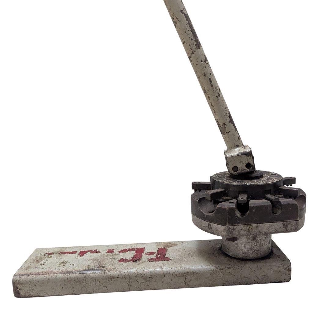 T-DRILL-ND-54-Tube-End-Notcher_6 | Chicago HVAC tools and supplies Vintage manual lever press with a circular rotating die and long metal handle on a rectangular base.