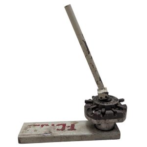 T-DRILL-ND-54-Tube-End-Notcher_7 | Chicago HVAC tools and supplies Vintage manual punch tool with a long lever and rotating dial mounted on a metal base, showing rust and wear