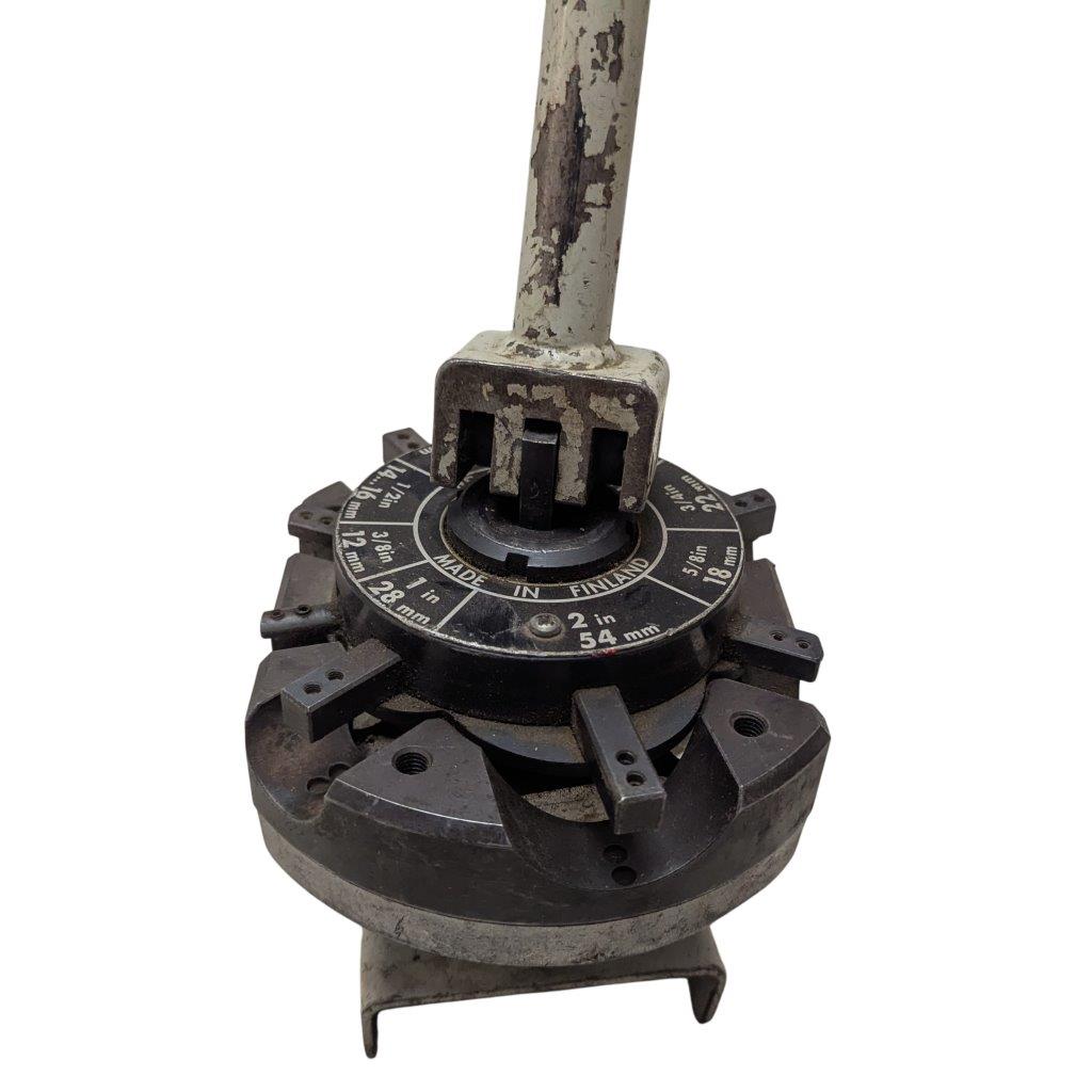 T-DRILL-ND-54-Tube-End-Notcher_9 | Chicago HVAC tools and supplies Close-up of a worn circular dial on a rotary jig with measurement marks and a vertical metal handle, used to set precise angles.